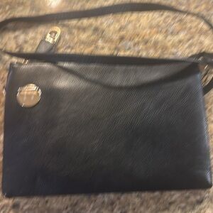 Boutique black faux leather purse. Slightly used.